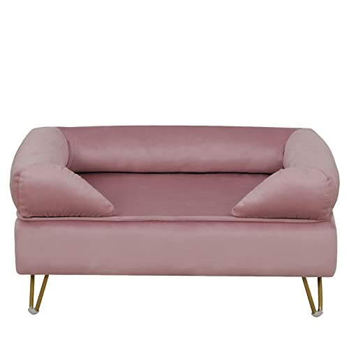 Pink velvet pet sofa with cushioned arms and sleek legs.